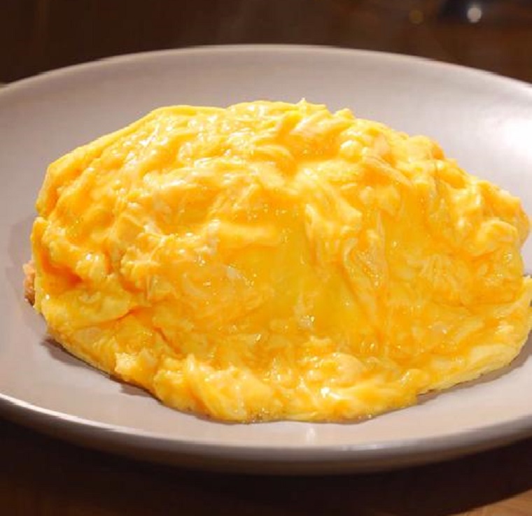 Delicious Fried Rice with Flowing Egg on Top